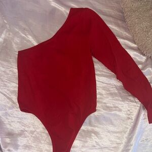 Red one sleeve body suit